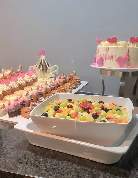 Dessert buffet with cakes, tarts and a fresh fruit platter