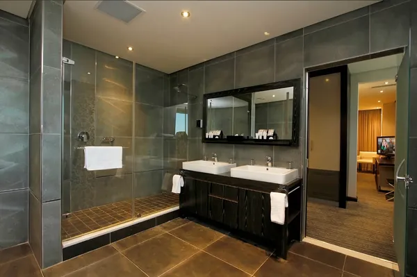 Ensuite bathroom in slate tile with a walk-in shower and double vanity